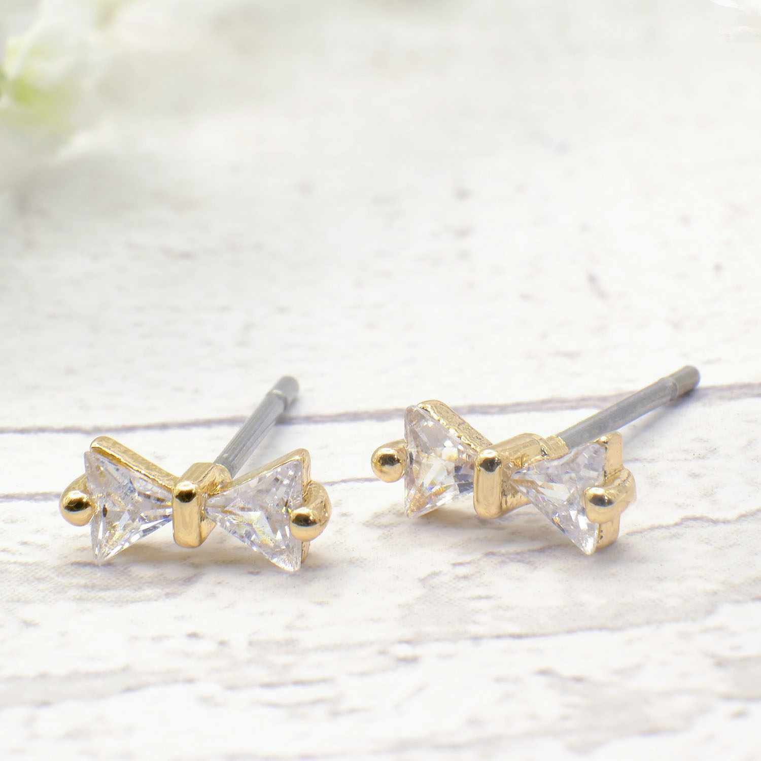 Tiny Gold Bow Studs With Crystal Insert